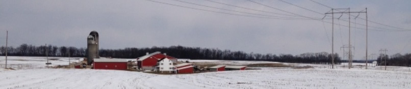 red farm and barn in snow